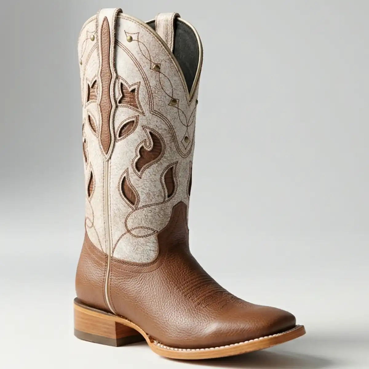 Studio shot of El General Women's Honey Brown Floter leather cowboy boot with a bone-colored embroidered shaft and wide square toe.