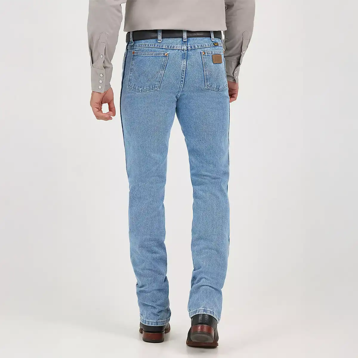 Rear view of Wrangler Men's Cowboy Cut 0936 slim fit jeans showing the Neolite leather patch and signature 'W' back pocket stitching.
