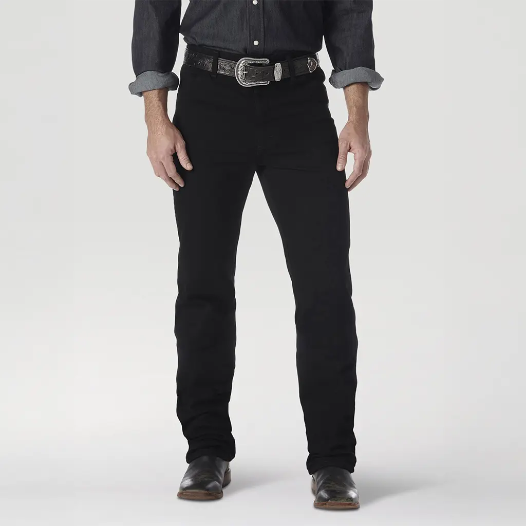 Front close-up view of the Wrangler Men's 0936WBK Cowboy Cut Slim Fit jeans showing the flat waistband, silver buckle, and black denim texture.