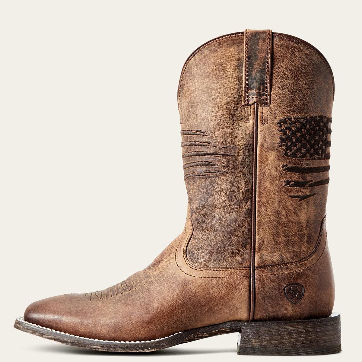 Ariat Men’s Circuit Patriot Cowboy Boot in antiqued distressed brown leather featuring an embroidered American flag shaft and a wide square toe profile.