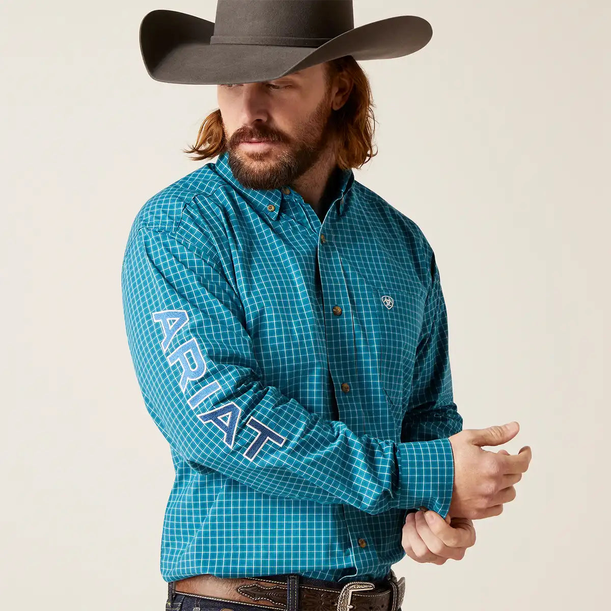 Pro arena performance! Shop Ariat Men's Pro Series Team Wayland Blue Shirt. Features Greater Arm Mobility™, UV protection, mesh yoke & sleeve logo.