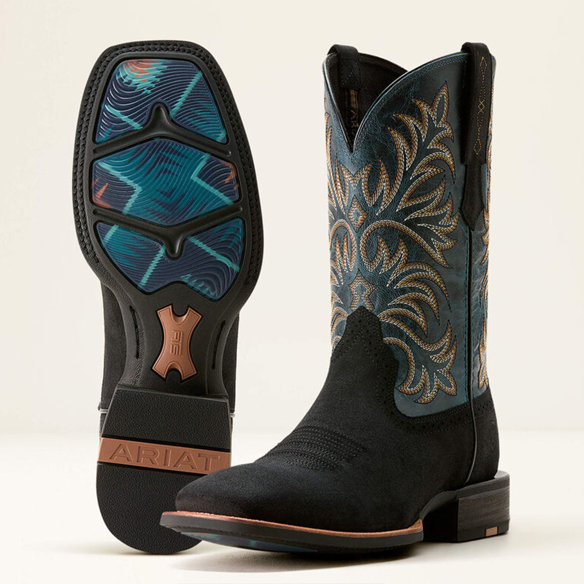 Ariat men's black square toe cowboy boots with intricate blue and brown patterns on a white background.