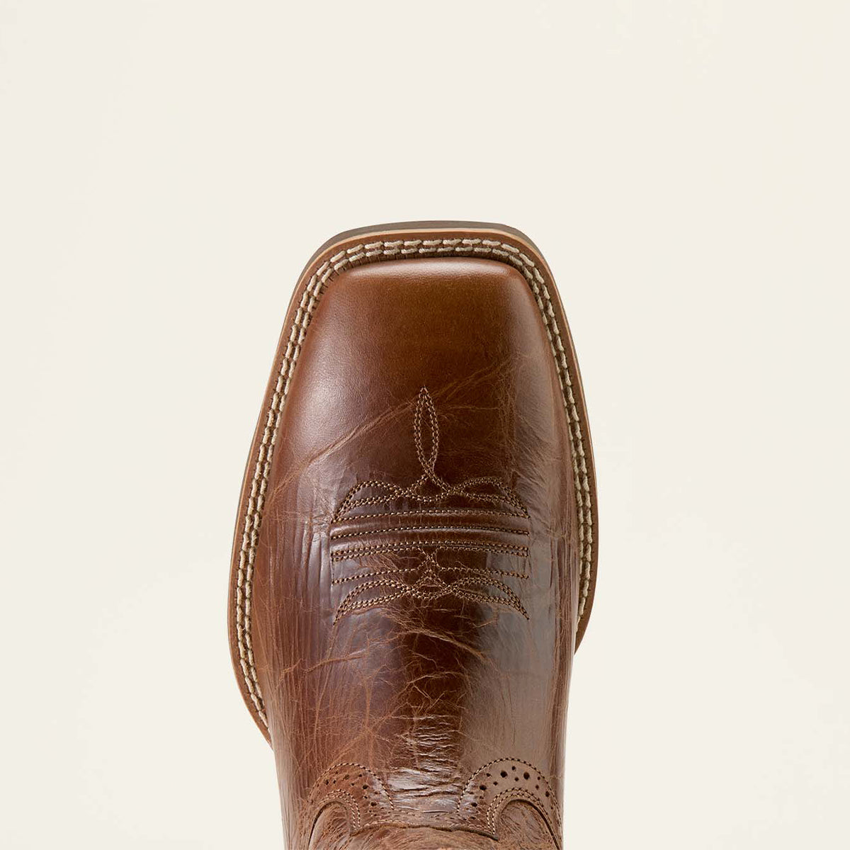 Overhead close-up view of the wide square toe on the Ariat men's Sport Western dark tan cowboy boot showcasing the double welt stitching.