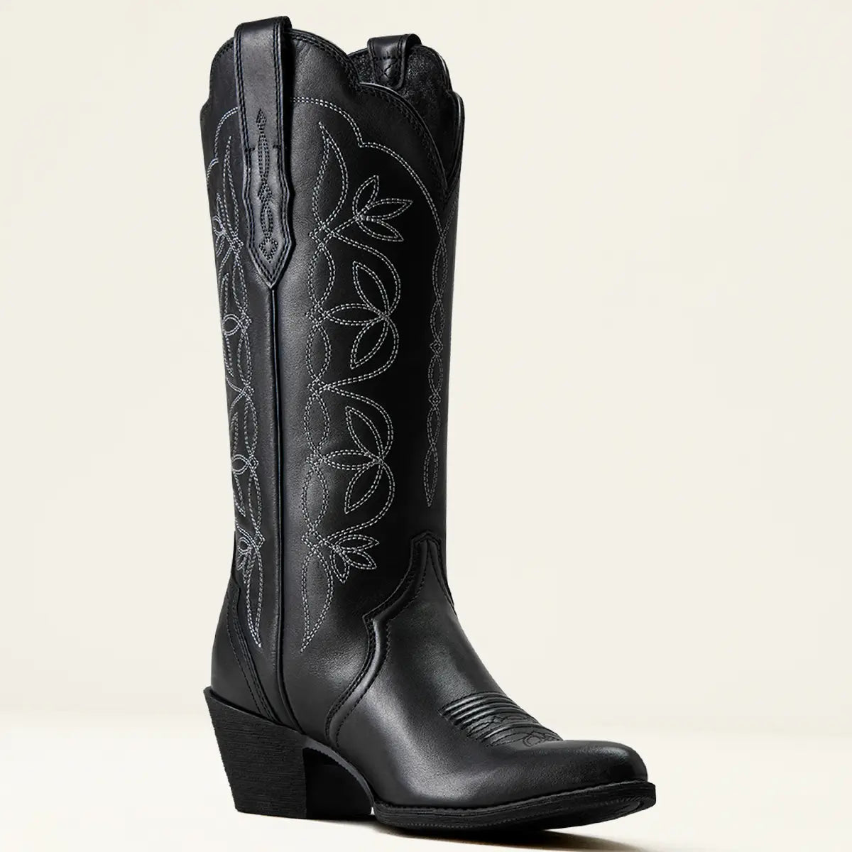 Medial side view of the Ariat Women's Heritage Blossom Supple Black leather boot showcasing the full length shaft, floral embroidery, and inside pull strap.