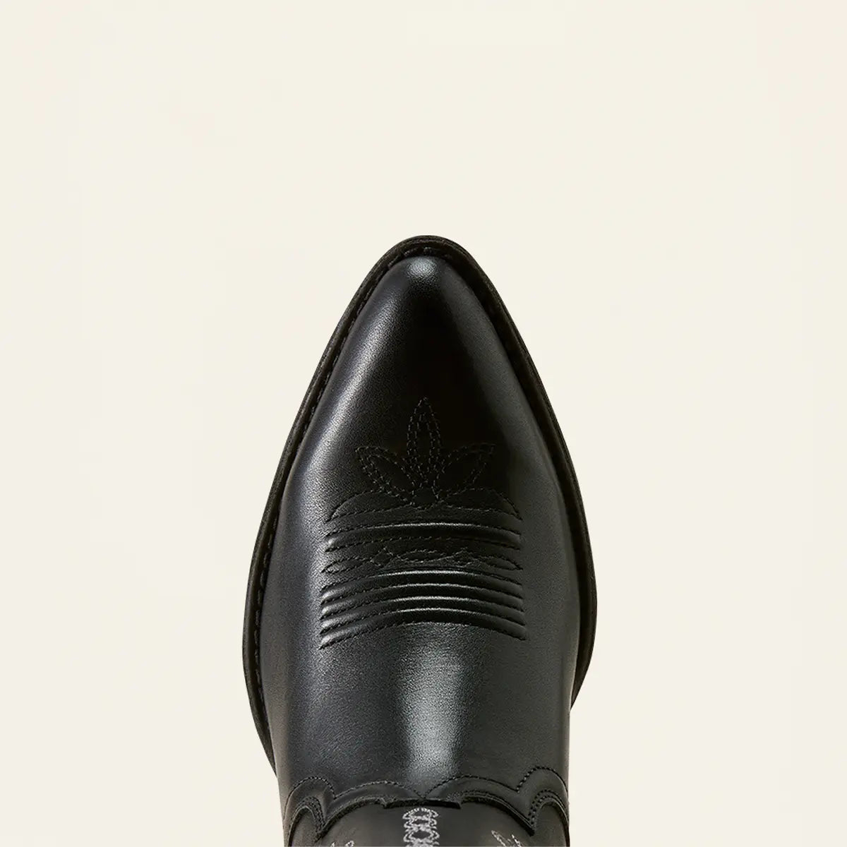Top-down close-up view of the classic J-toe profile and vamp bug-and-banner stitching on the Ariat Heritage Blossom boot.