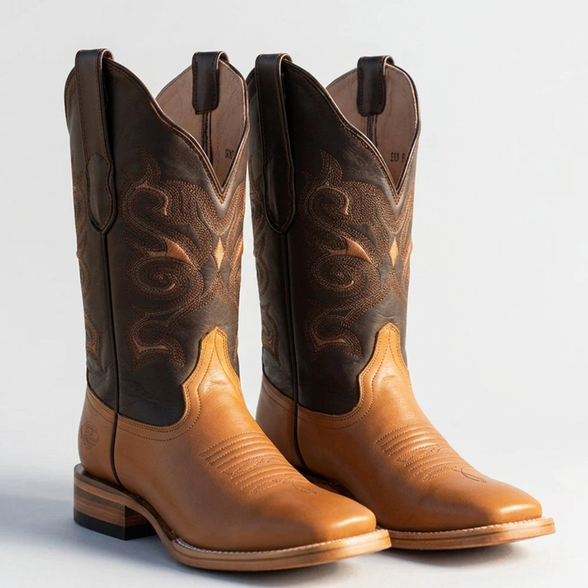 White Diamonds two-tone gold and dark brown square toe cowgirl boots with stitched shaft.