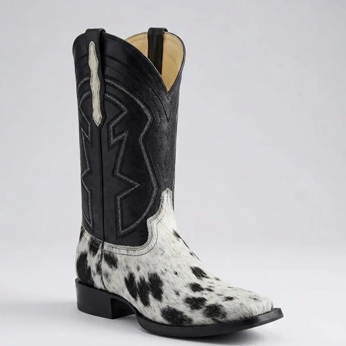 El General Men's black and white genuine hair-on cowhide cowboy boot with black leather shaft and square toe.