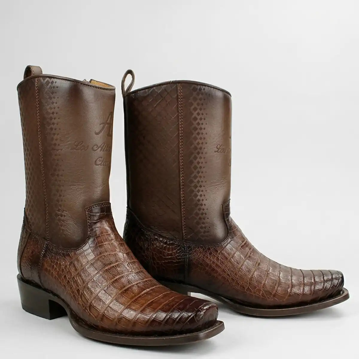 A pair of Los Altos men's brown leather cowboy boots with a caiman belly leather, and a woven pattern on the upper shaft, shown against a light gray background.