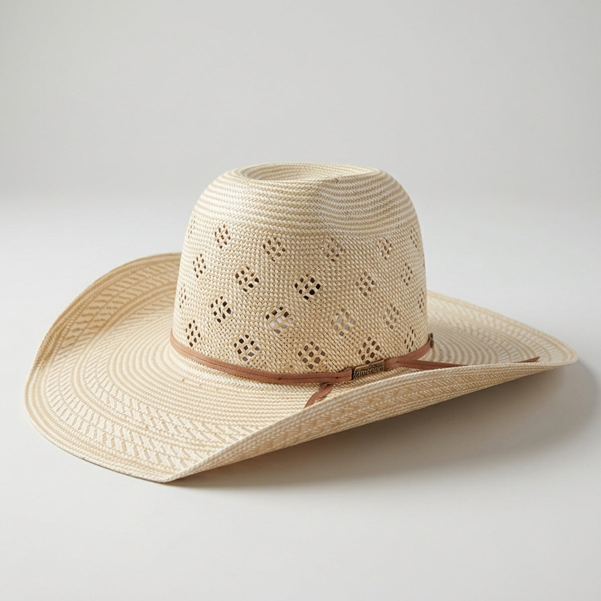 American Hat Company light beige woven straw cowboy hat with a brown ribbon band, shown on a neutral light gray background.