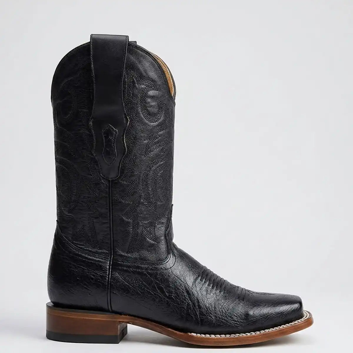 Side profile view of the Los Altos black smooth ostrich belly cowboy boot showing the 1.5" block heel and Goodyear welt stitching.