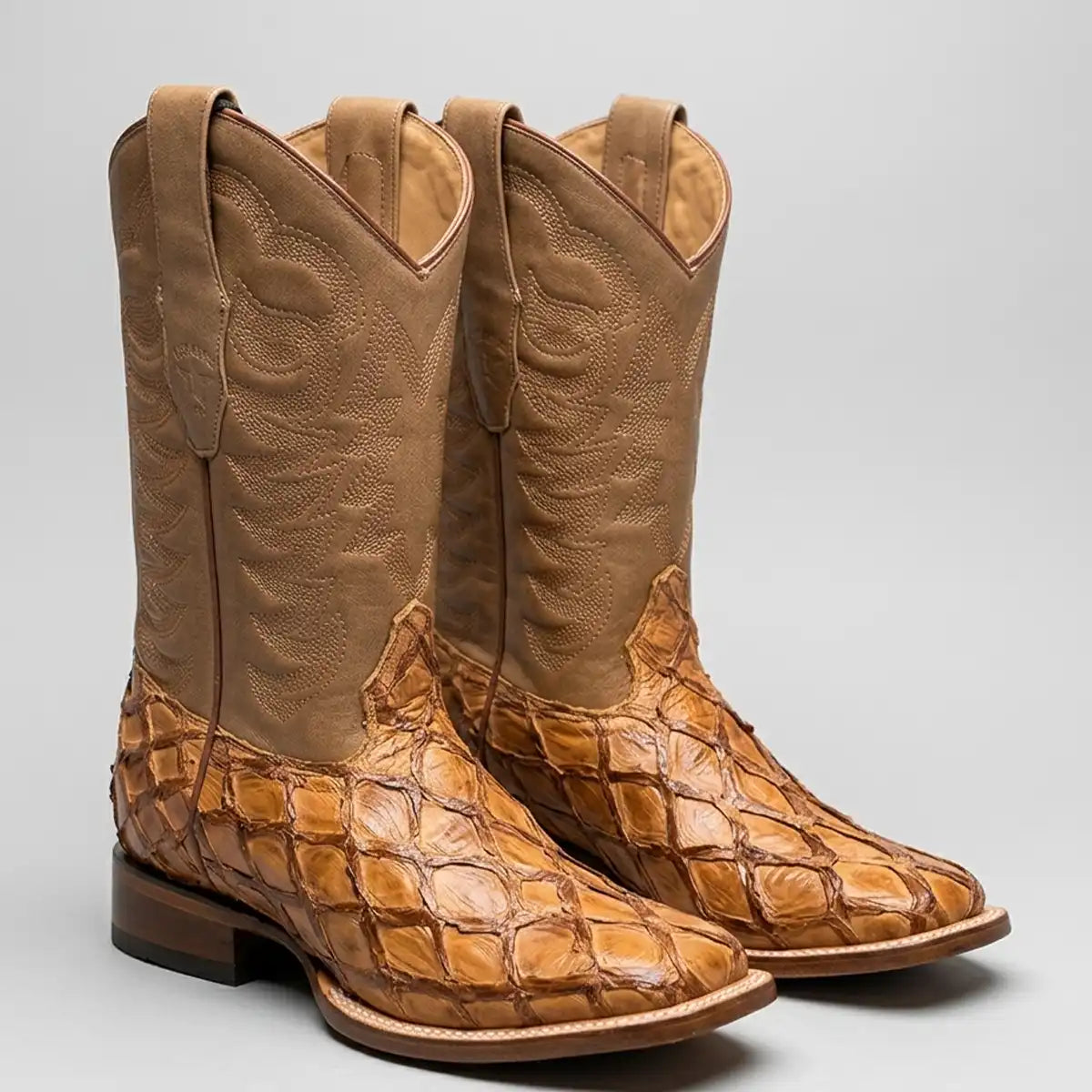 Pair of Los Altos Men's Oryx tan Pirarucu fish leather wide square toe cowboy boots with matching embroidered leather shaft.