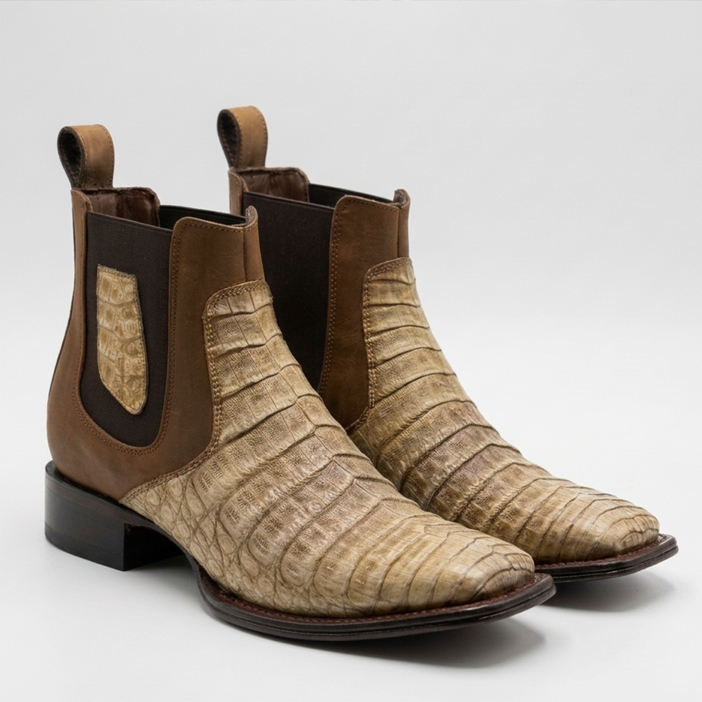 A pair of Los Altos men's sahara stone tan genuine caiman belly leather Chelsea western boots featuring a tiled tile scale pattern, brown elastic side goring, and a square toe.