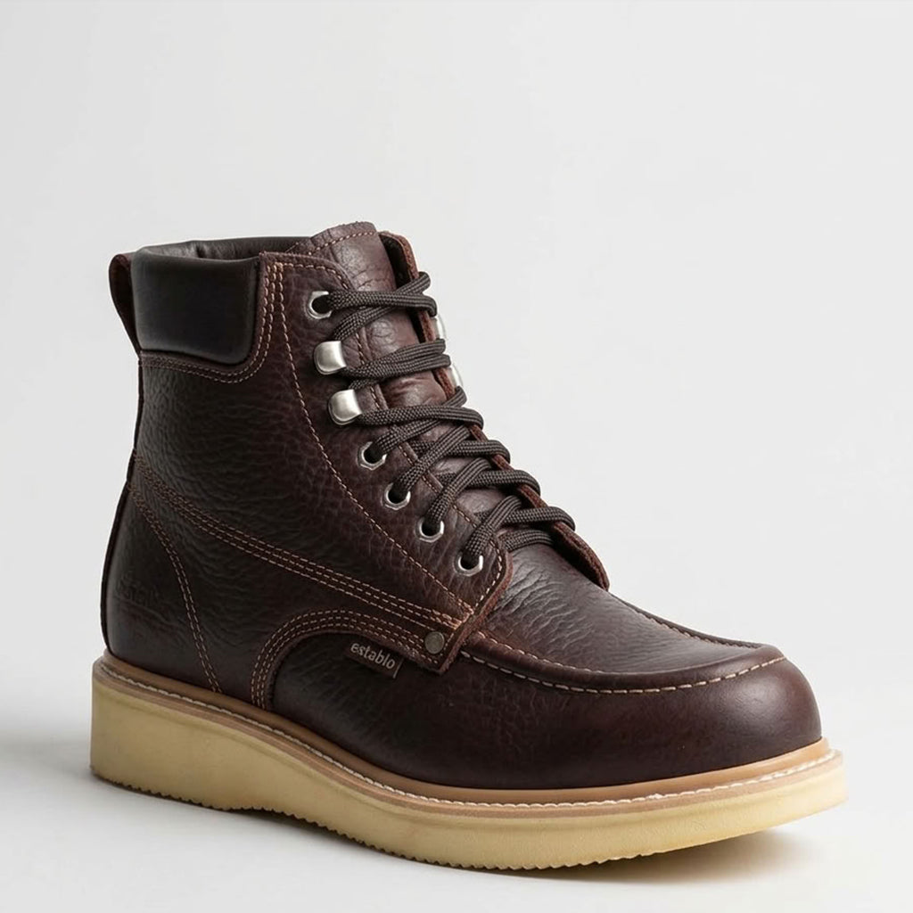 Studio profile view of the Establo Men's 6-inch dark shedron brown oiled leather moc toe work boot displaying the padded collar, metal eyelets, Goodyear welt, and cream PU wedge sole.