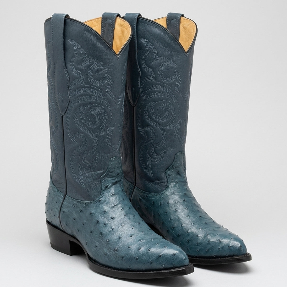 A pair Los Altos western boots in a teal blue leather, featuring genuine ostrich leather foot.