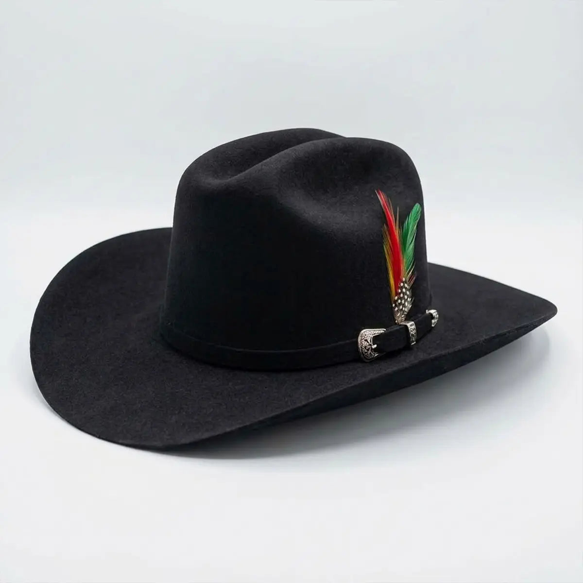 Side angle view of the Abolengo 1000X black rabbit fur felt cowboy hat displayed in-store showcasing the Sinaloa brim shape, silver buckle set, and colorful feather accent.