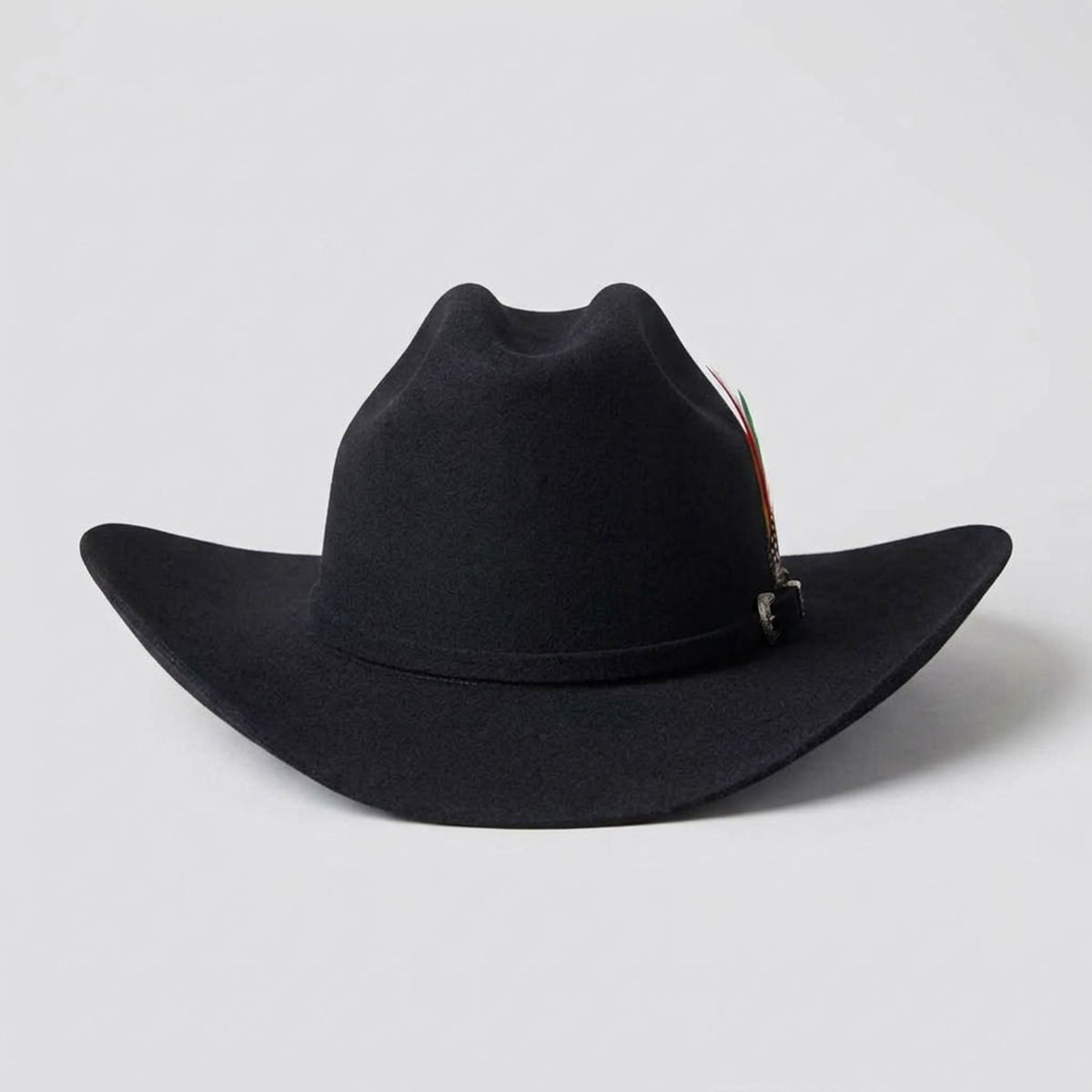 Front view of the Abolengo 100X black wool blend cowboy hat displaying the Cattleman crown crease, Sinaloa brim shape, silver buckle set, and feather accent.