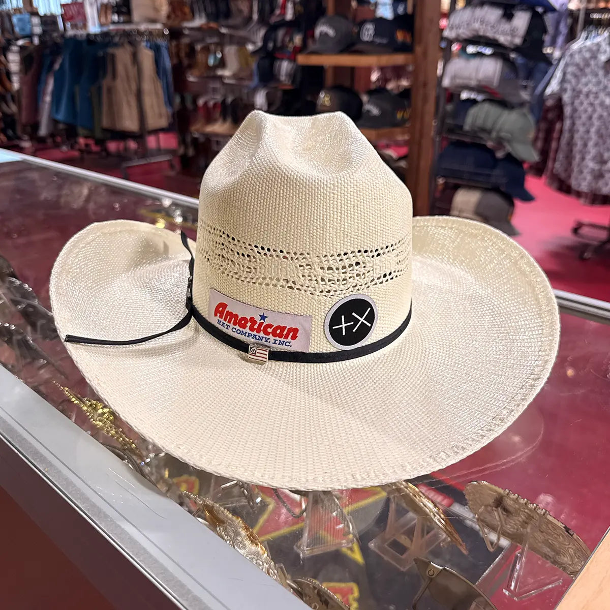In-store back view of the American Hat Co. 657 Bangora straw cowboy hat showcasing the Cattleman crown symmetry and curved brim shape.