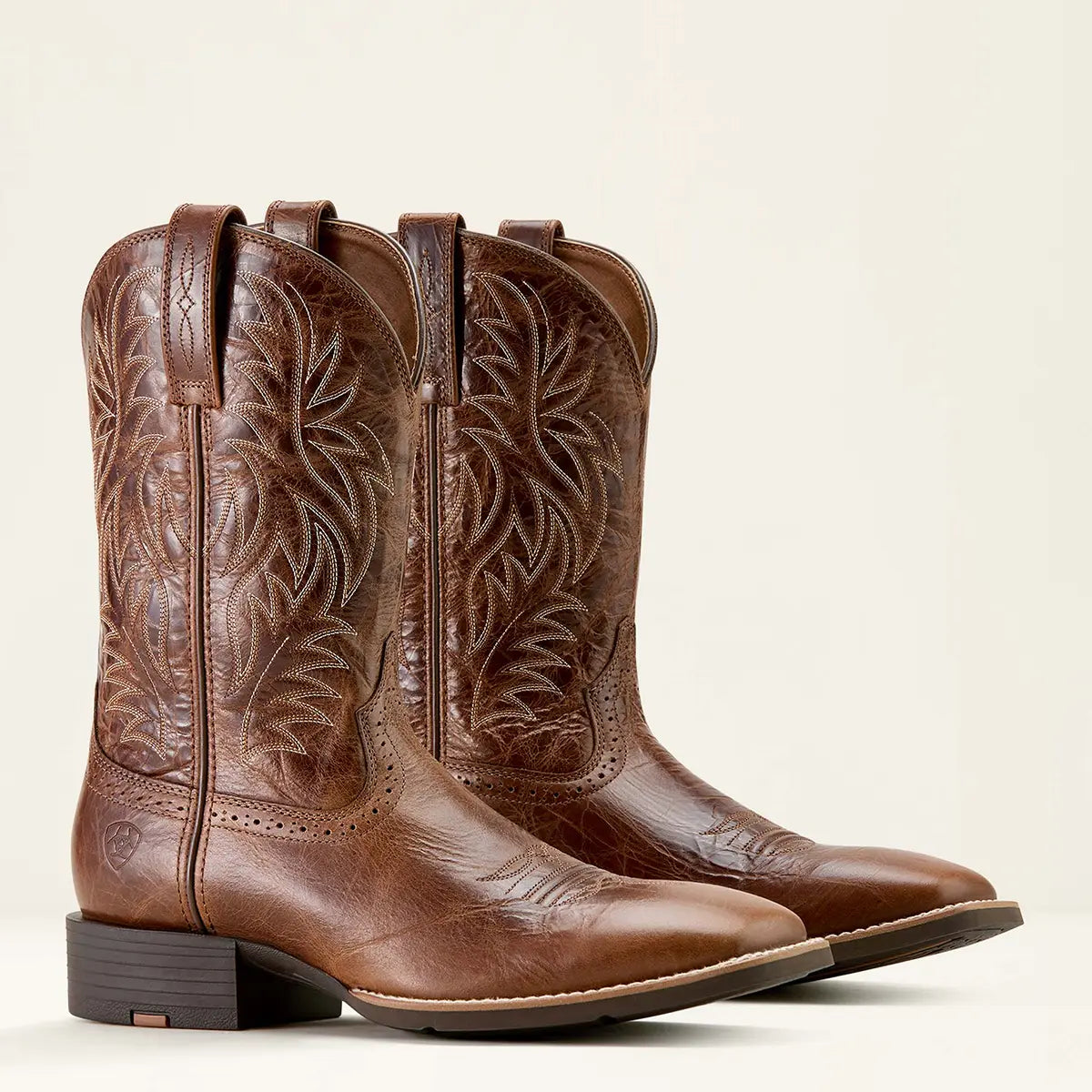 Studio pair view of Ariat men's Sport Western dark tan wide square toe cowboy boots standing together on a neutral background.