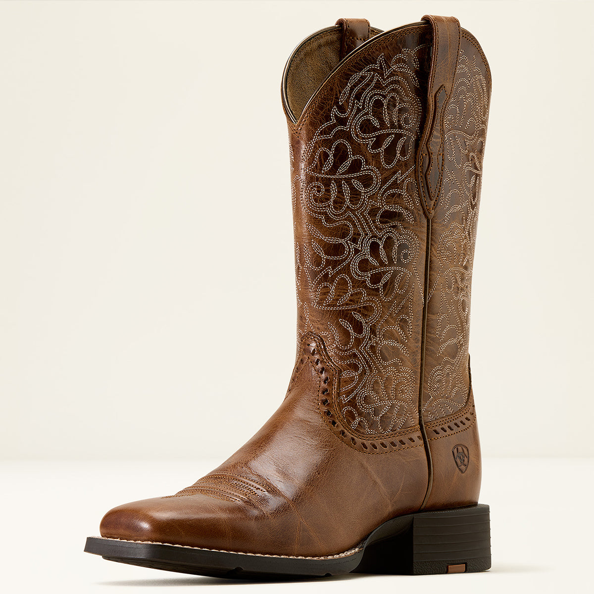 Ariat Women’s Round Up Remuda Cowgirl Boot in Aged Tan leather featuring intricate cutwork-style embroidery on an 11-inch shaft and a wide square toe.