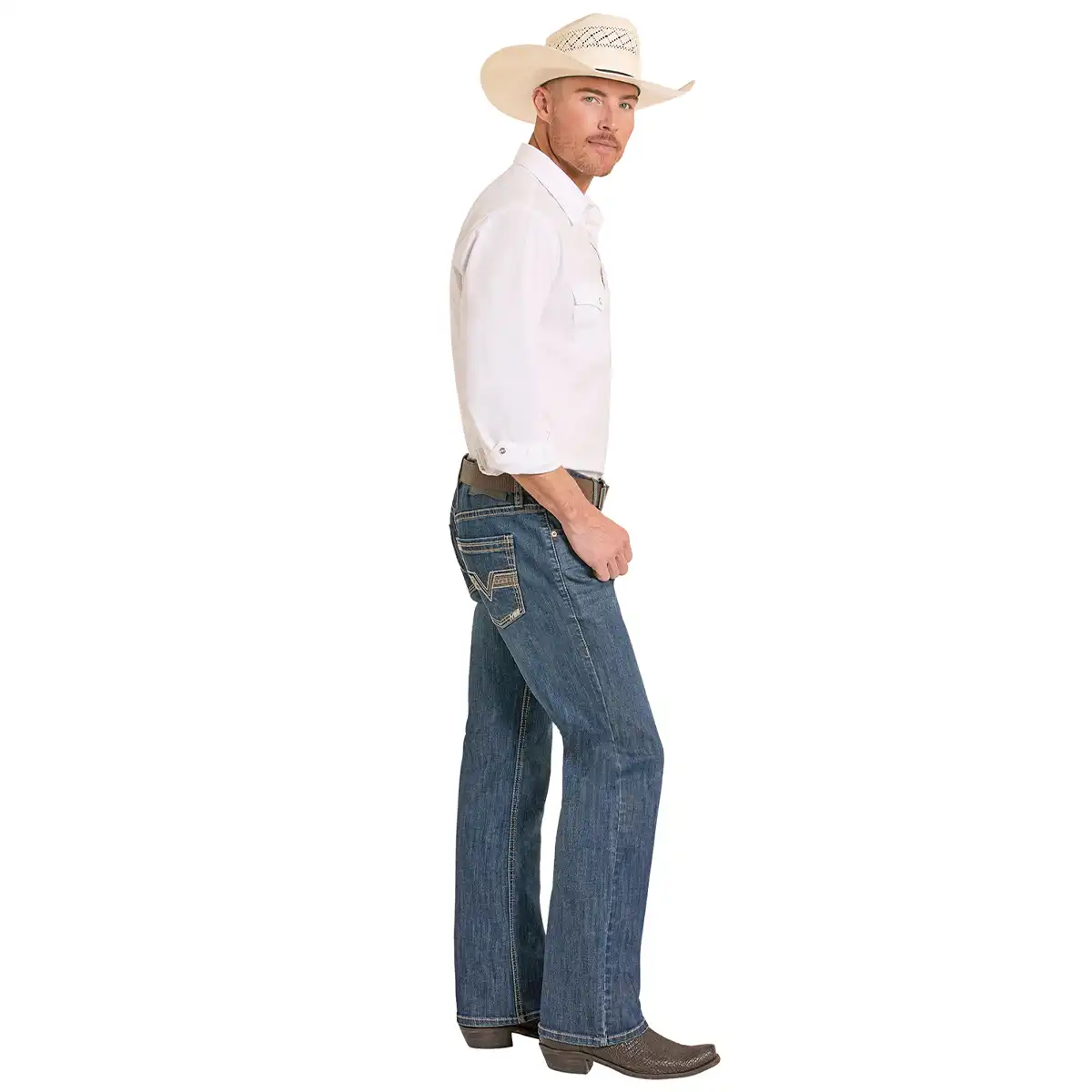 A man wearing a white long-sleeve western shirt, blue jeans with western-style stitching, a beige cowboy hat, and brown boots, shown in profile against a plain white background.