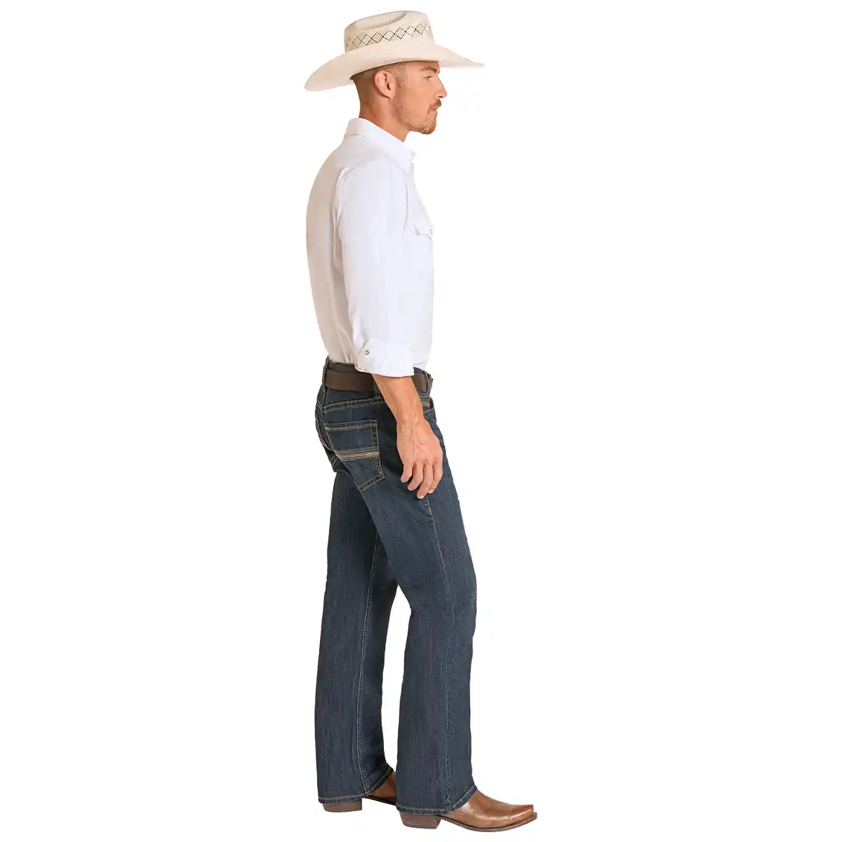 A man shown in profile wearing a light beige cowboy hat, a white long-sleeve button-up shirt, dark blue jeans, a brown belt, and brown cowboy boots against a plain white background.