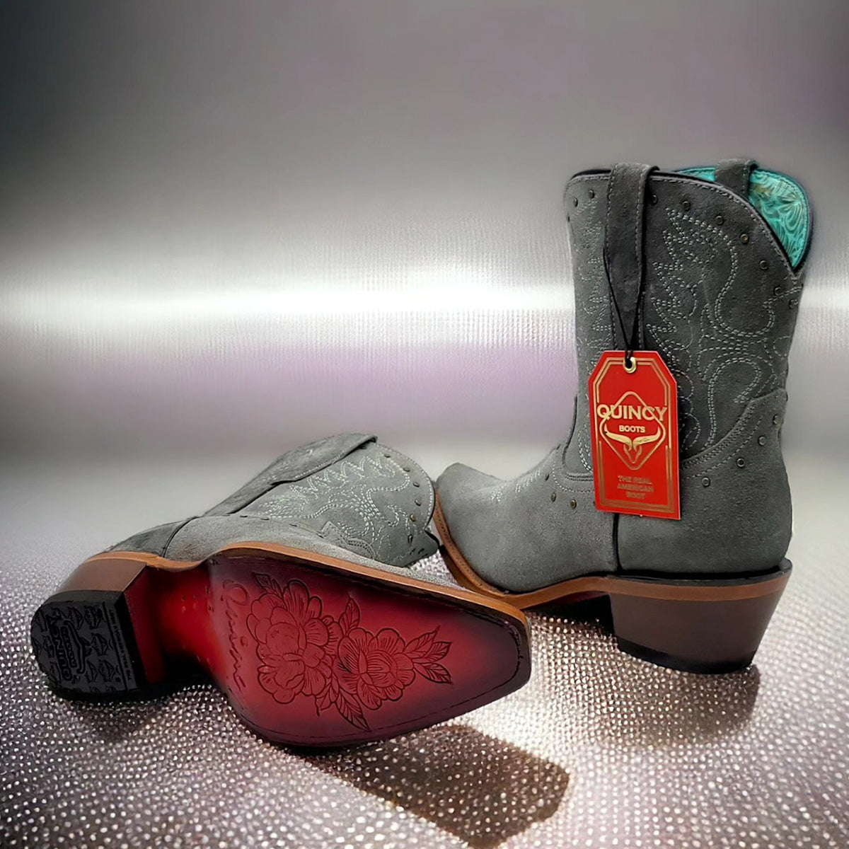 Blue women's booties by Quincy