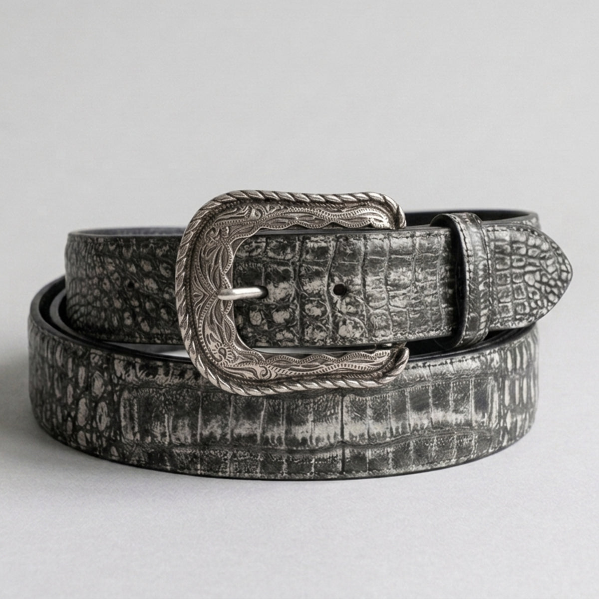 Los Altos men's Sahara Black genuine caiman belly leather belt showing a rustic two-tone grey and black scale texture with an engraved silver-tone western heel-bar buckle.