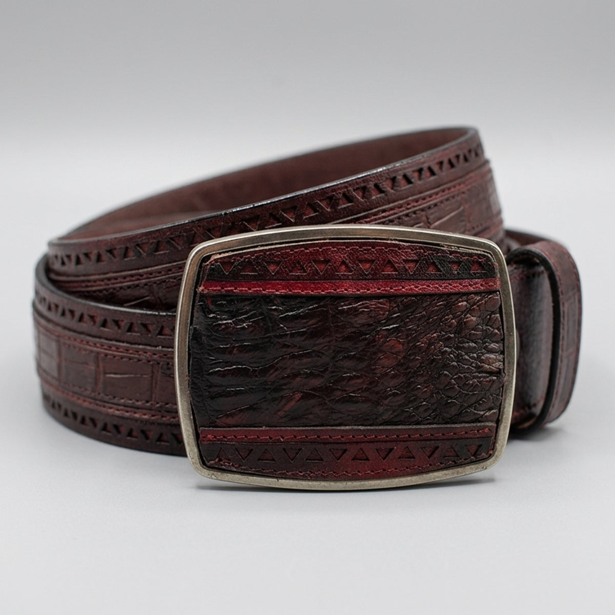 Los Altos men's black cherry genuine caiman belly leather belt with laser-cut geometric border detailing and a matching rectangular buckle.