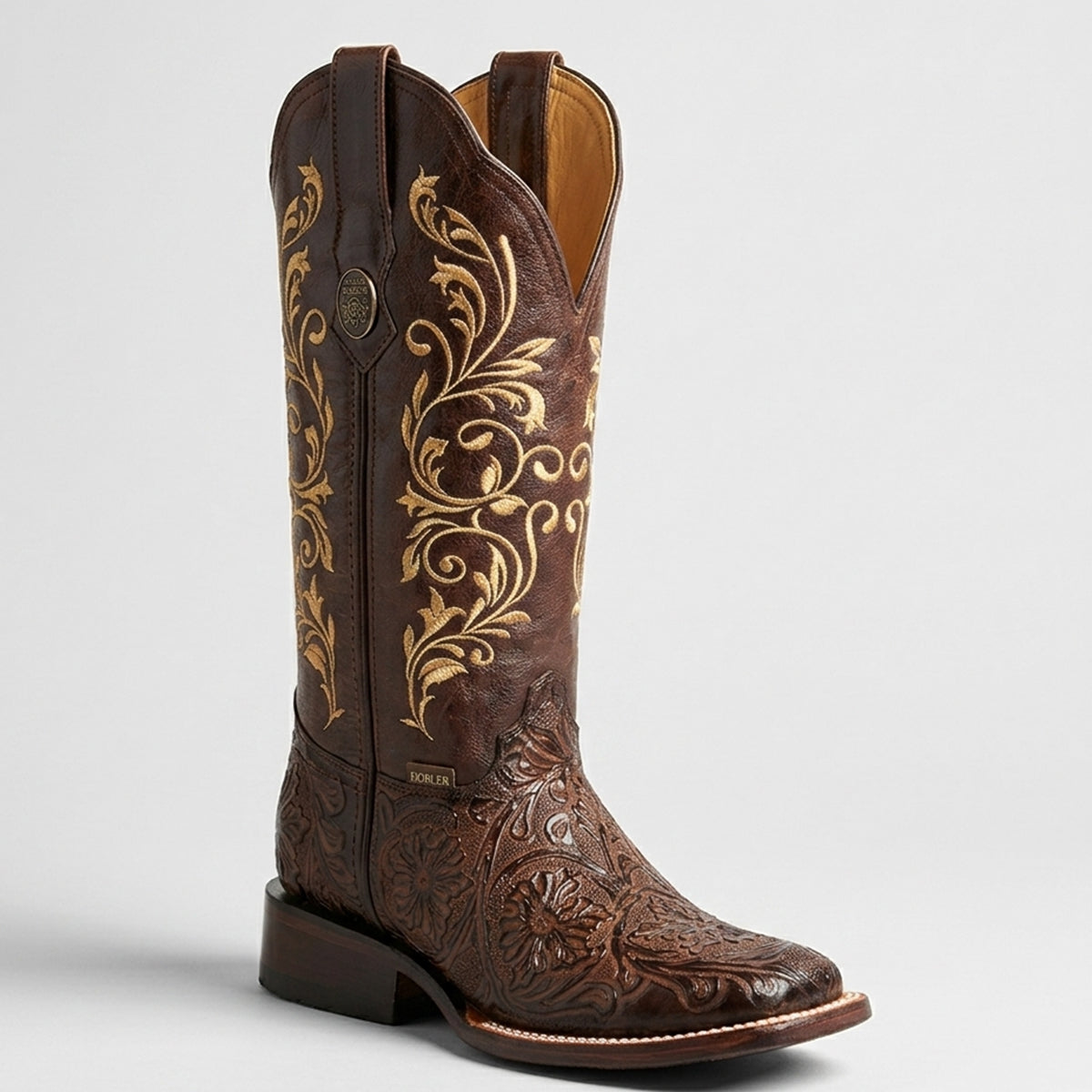 Botas Doble R women's dark brown floral tooled print cowgirl boot featuring intricate golden Western stitching on the shaft and a square toe.