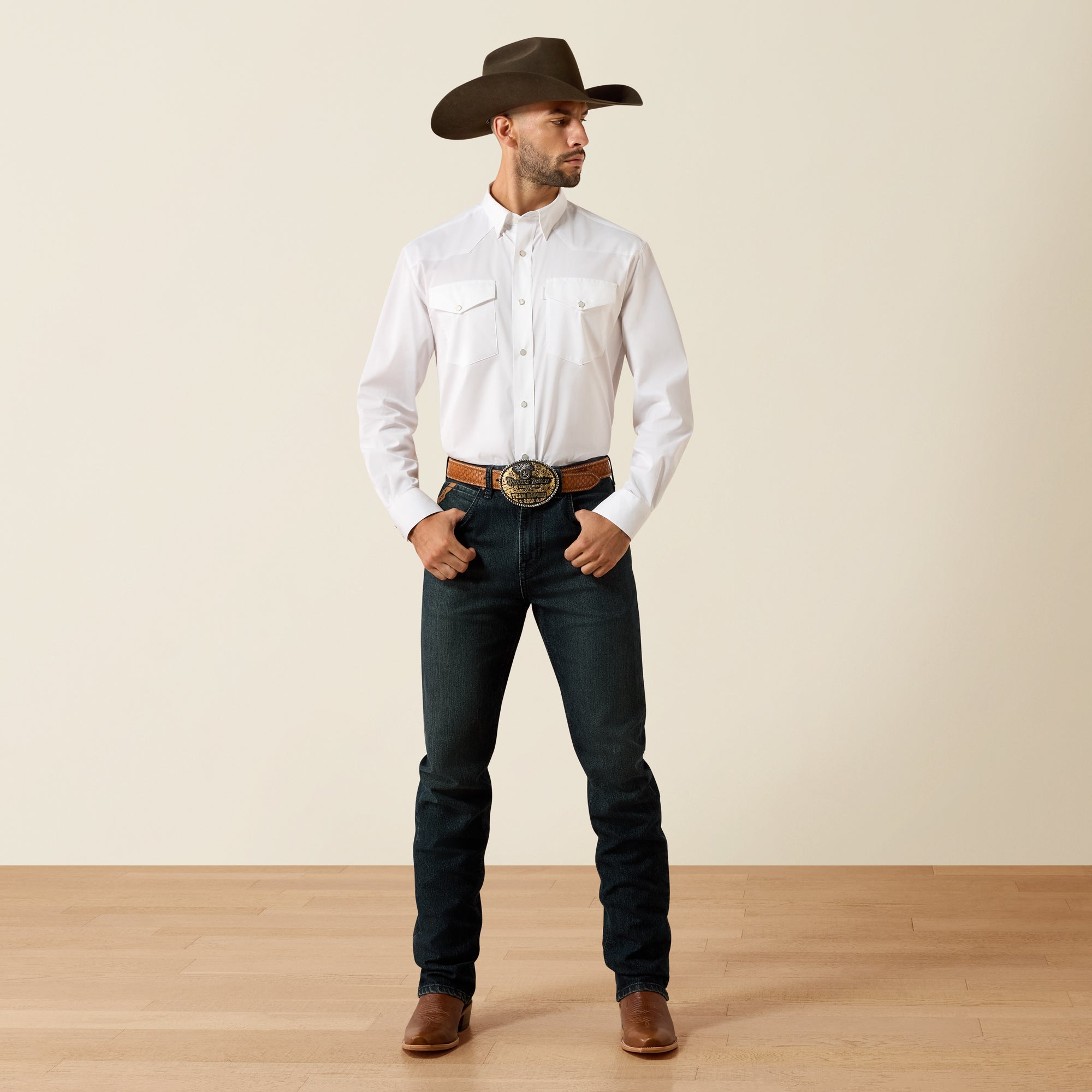 Full-body view of a man wearing the Ariat Men's Everything White long sleeve Western snap shirt with cowboy hat, jeans, and boots.