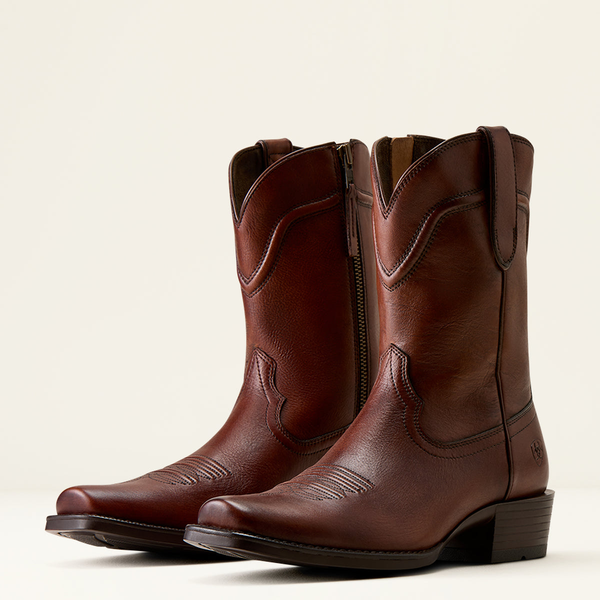Pair studio view of the Ariat Men's Oliver boots showcasing both outer profile and inner side zip closure.