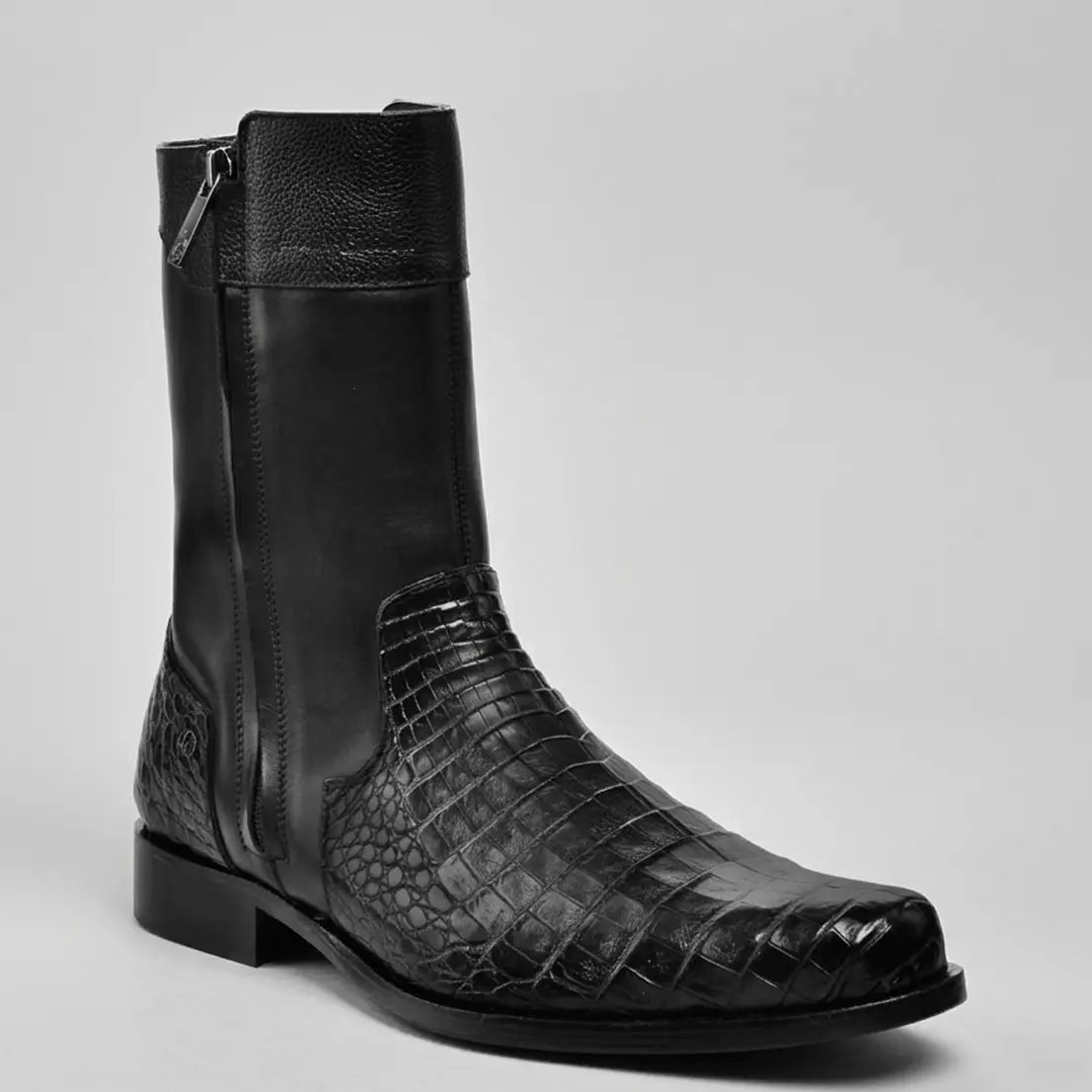 Studio profile view of the Cuadra Men's Short Caiman Belly boot in jet black showcasing the polished finish, dual zipper closures, and 1" heel.