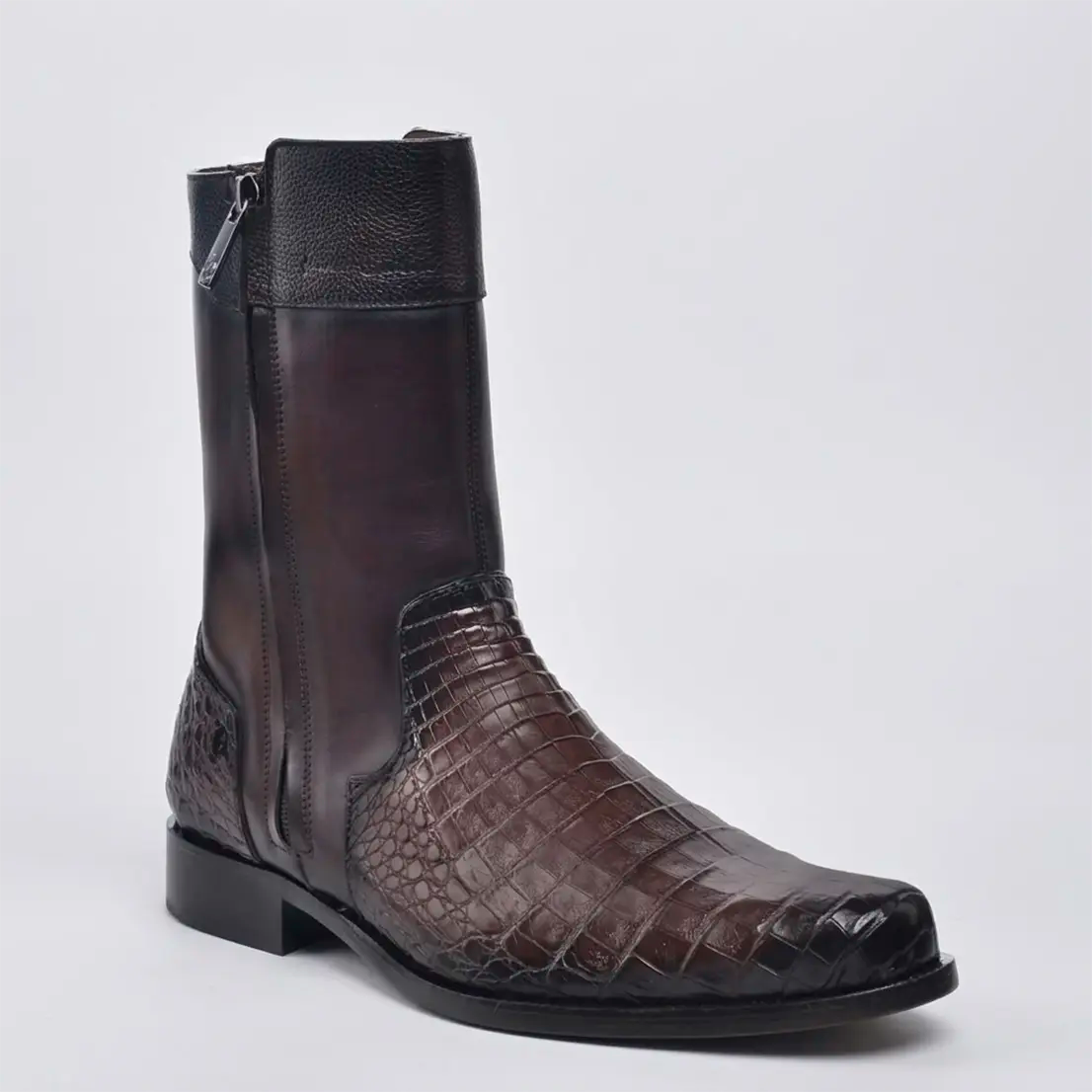 Studio profile view of the Cuadra Men's Short Caiman Belly boot in shaded dark brown displaying the R toe, double zippers, and genuine scale texture.