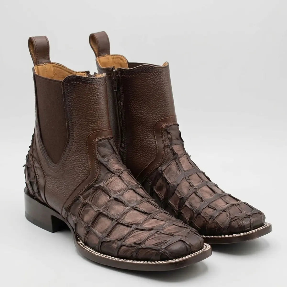 Pair studio view of the Los Altos Cortez men's faded tobacco brown pirarucu leather Chelsea square toe boots showing the large scale texture and pebbled upper shaft.