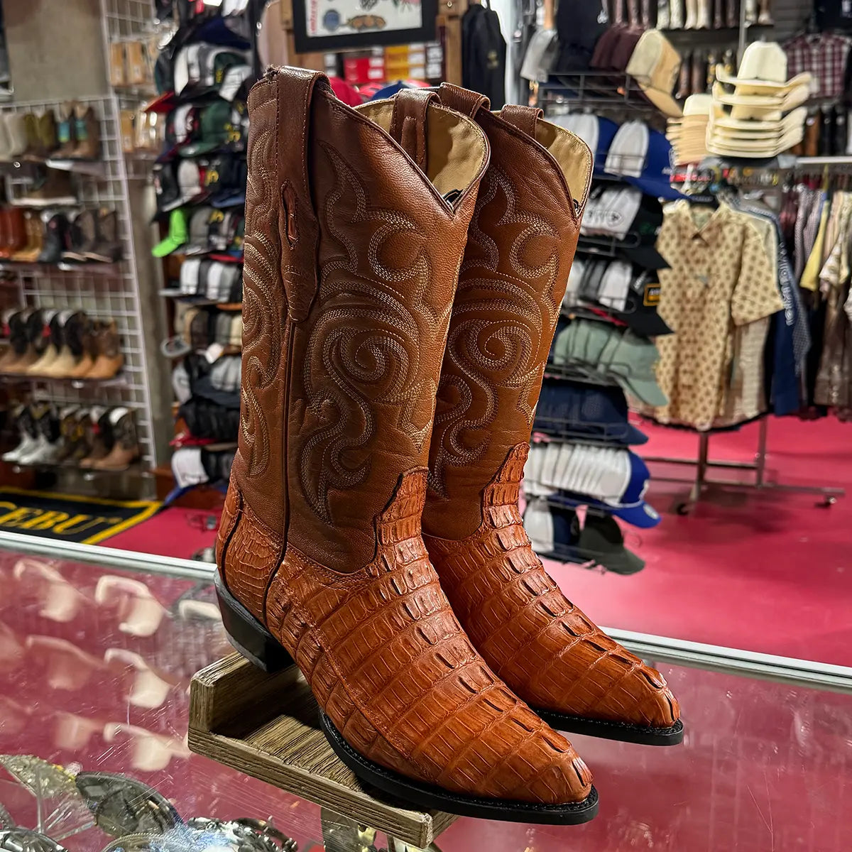 Retail display pair shot of the Los Altos Cognac Caiman Tail Western boots highlighting the pointed J-toe shape and cognac leather upper.