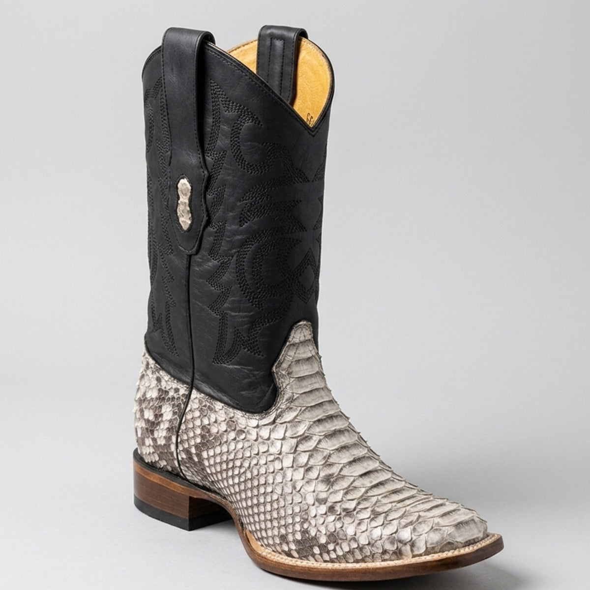 Los Altos men's western cowboy boot featuring a natural black and white python snakeskin foot, a stitched black leather shaft, and a modern square toe.