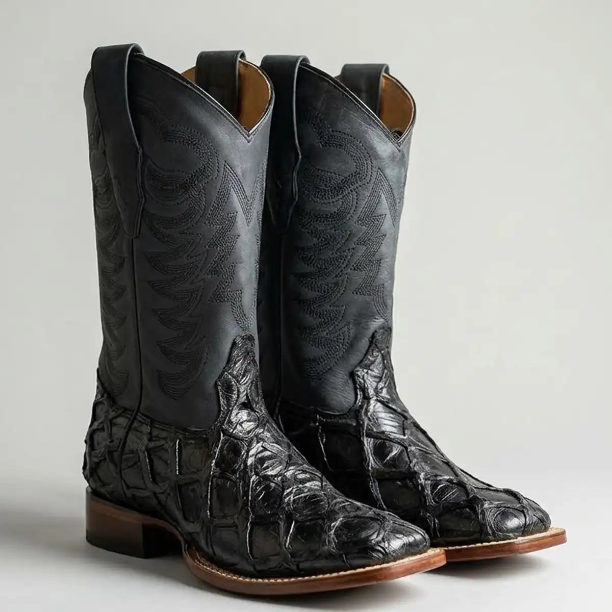 Pair studio shot of the Los Altos black glossy pirarucu cowboy boots against a plain white background.