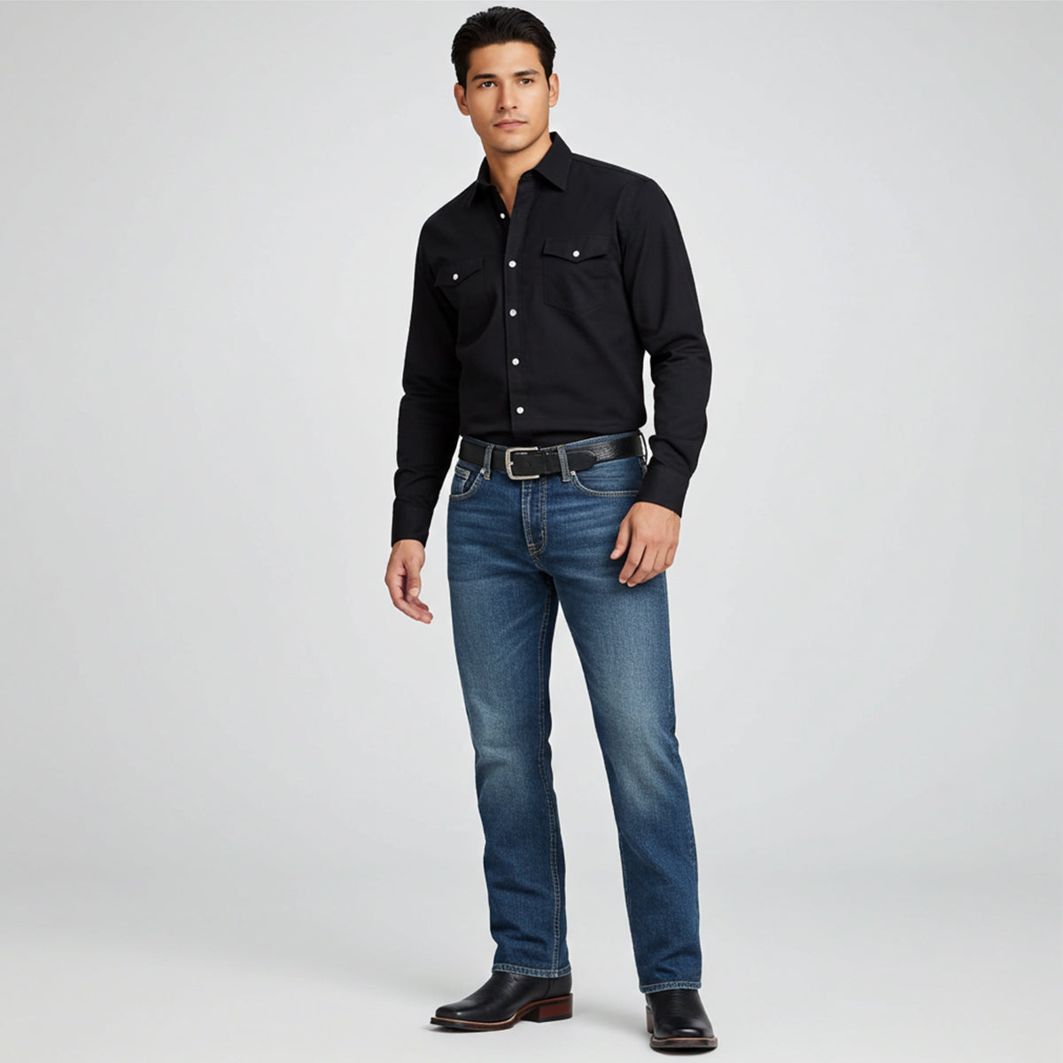 Man wearing black square toe cowboy boots with black western shirt
