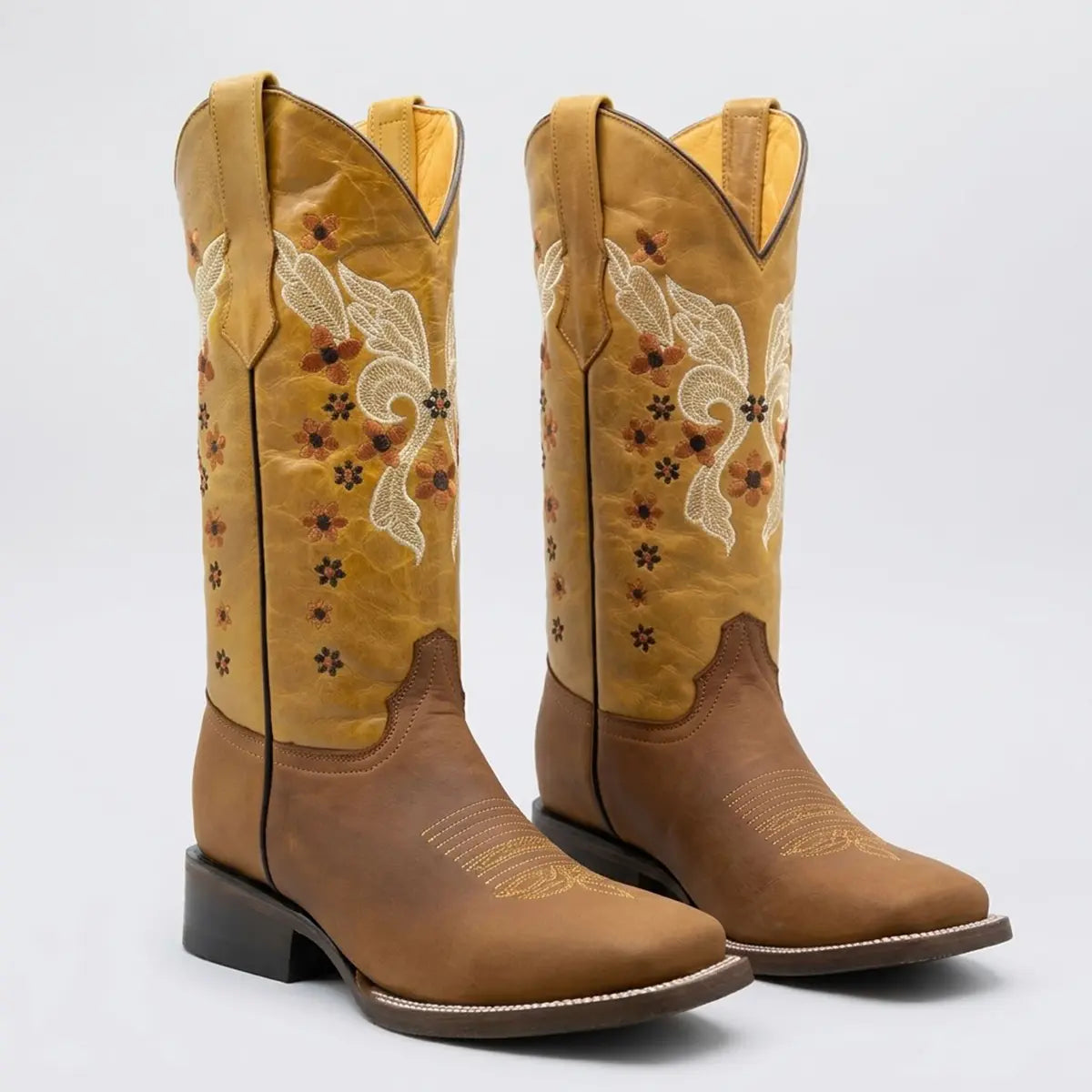 Studio pair view of the Flowered Butterfly women's square toe leather cowgirl boots from a three-quarter angle.