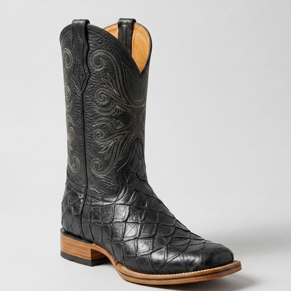 Men's black Pirarucu fish print square toe cowboy boot with detailed Western stitching on the upper shaft and a natural leather welt.