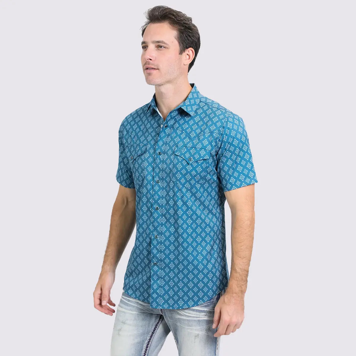 Three-quarter side view of a male model wearing the Platini blue Aztec short sleeve Western performance shirt.