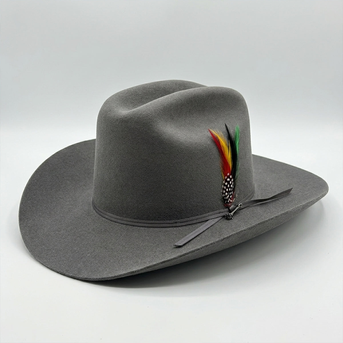 Stetson Rancher 6x gray felt cowboy hat with feathers on a white background.