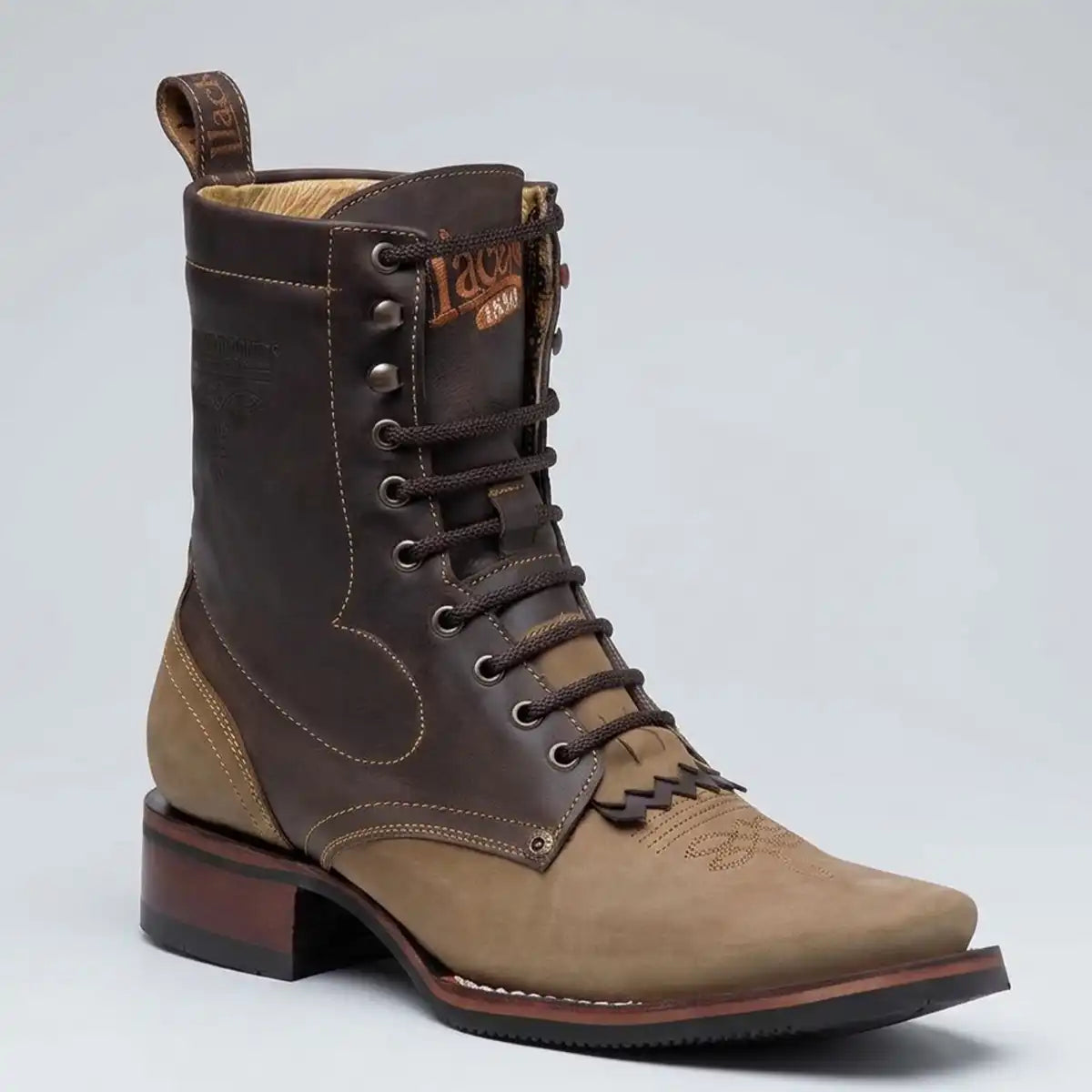 A mid-calf lace-up western boot in dark brown and tan leather, shown from a three-quarter angle against a light gray studio background.