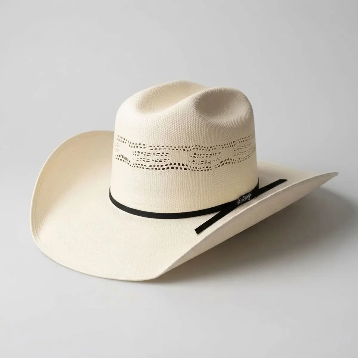 Three-quarter display view of the Abolengo Bangora straw cowboy hat featuring the 5 1/4-inch vented Minnick crown, black ribbon band, and Abolengo pin.