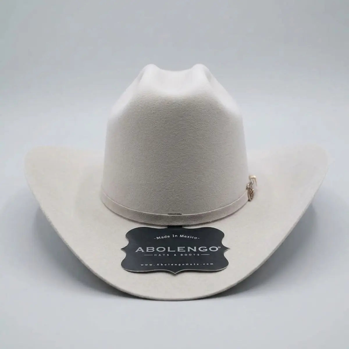 Front view of the Abolengo Rancheron 1000X silverbelly rabbit fur felt western hat displaying the Cattleman crown crease, silver buckle set, and feather accent.