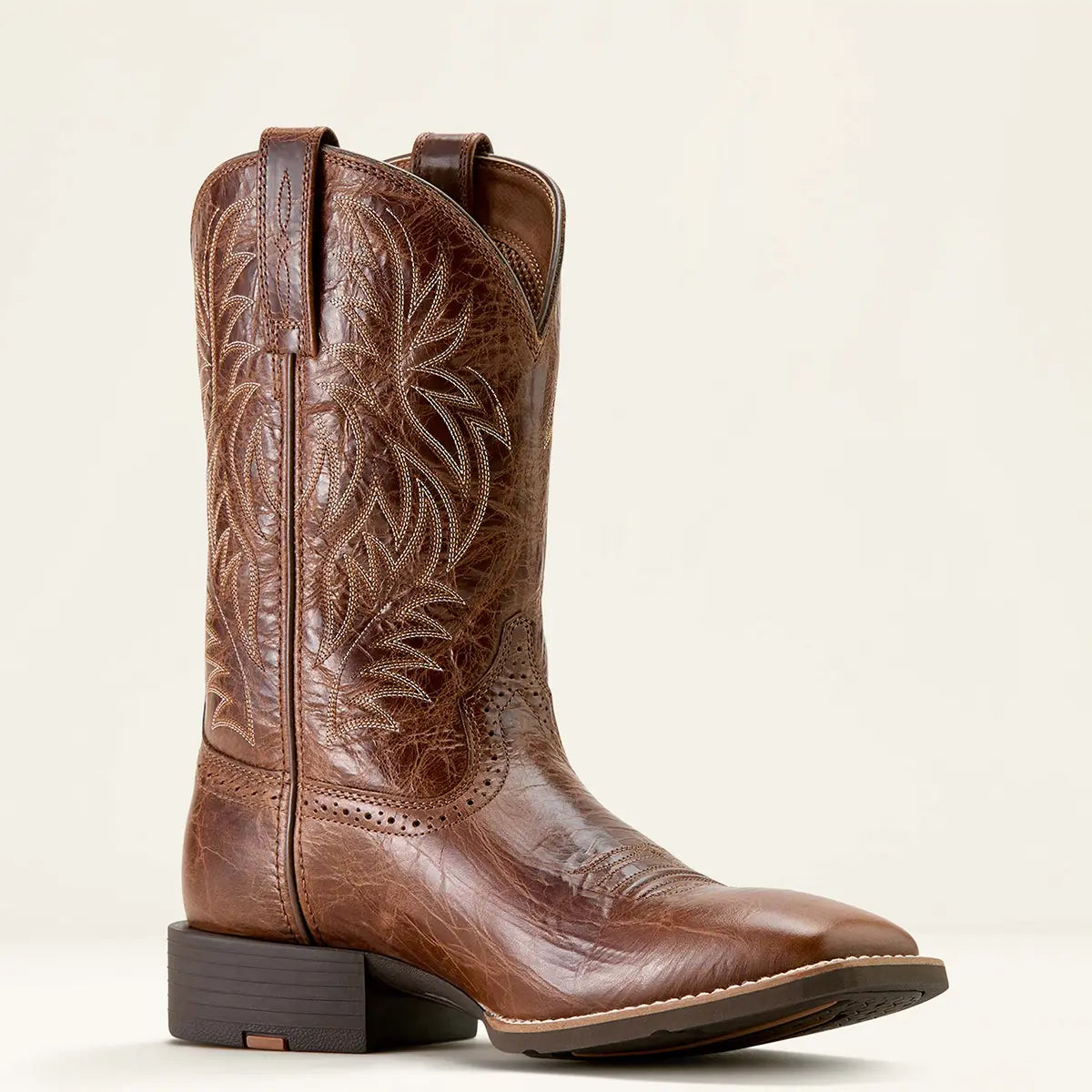 Medial side studio view of the Ariat men's Sport Western dark tan leather cowboy boot displaying the 11-inch shaft, four-row stitch pattern, and Duratread rubber sole.