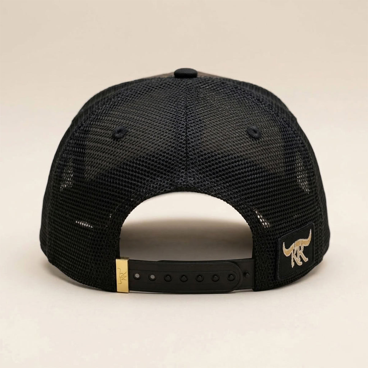 Straight-on back view of The King Ranch "Perico" cap showing the black mesh back panels, longhorn rear patch, and gold clip snapback closure.