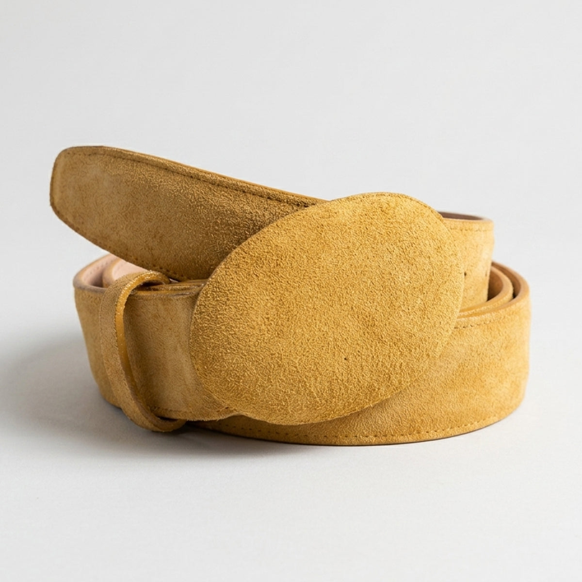 Los Altos light brown suede belt on a light gray background.