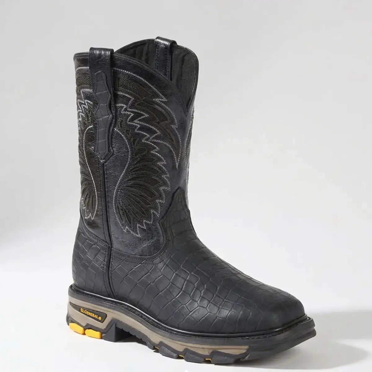 Side angle studio view of the El General men's black caiman print work boot highlighting the heavy-duty tractor outsole, square toe profile, and leather pull tabs.