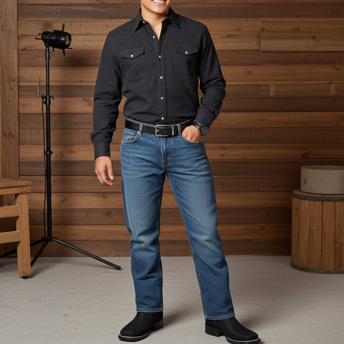 Man wearing black snake skin print square toe cowboy boots